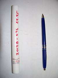 polymer with pen for scale, showing similar sizes